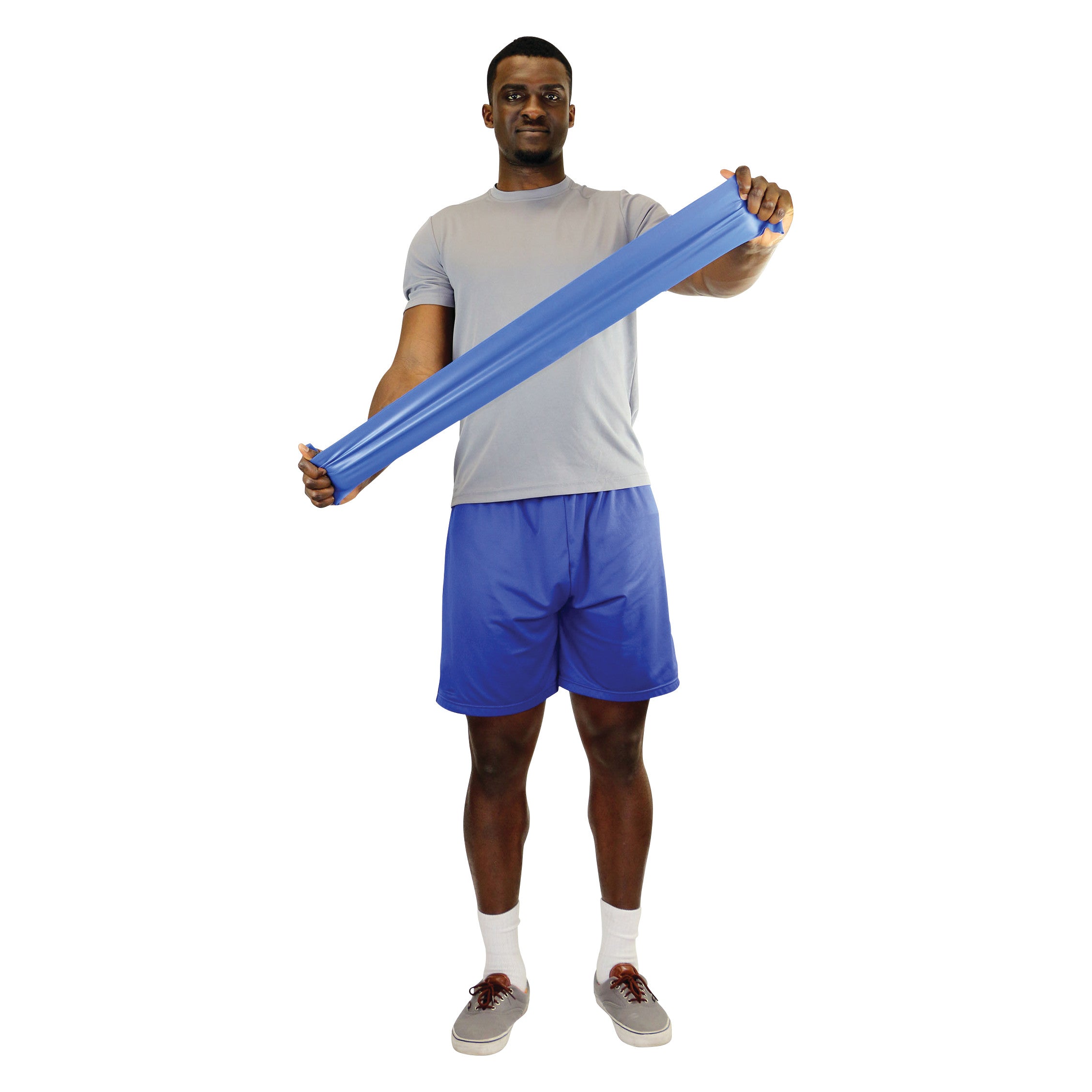 A person stretches a blue CanDo Latex Exercise Band while wearing a gray shirt and blue shorts, standing on a white background.