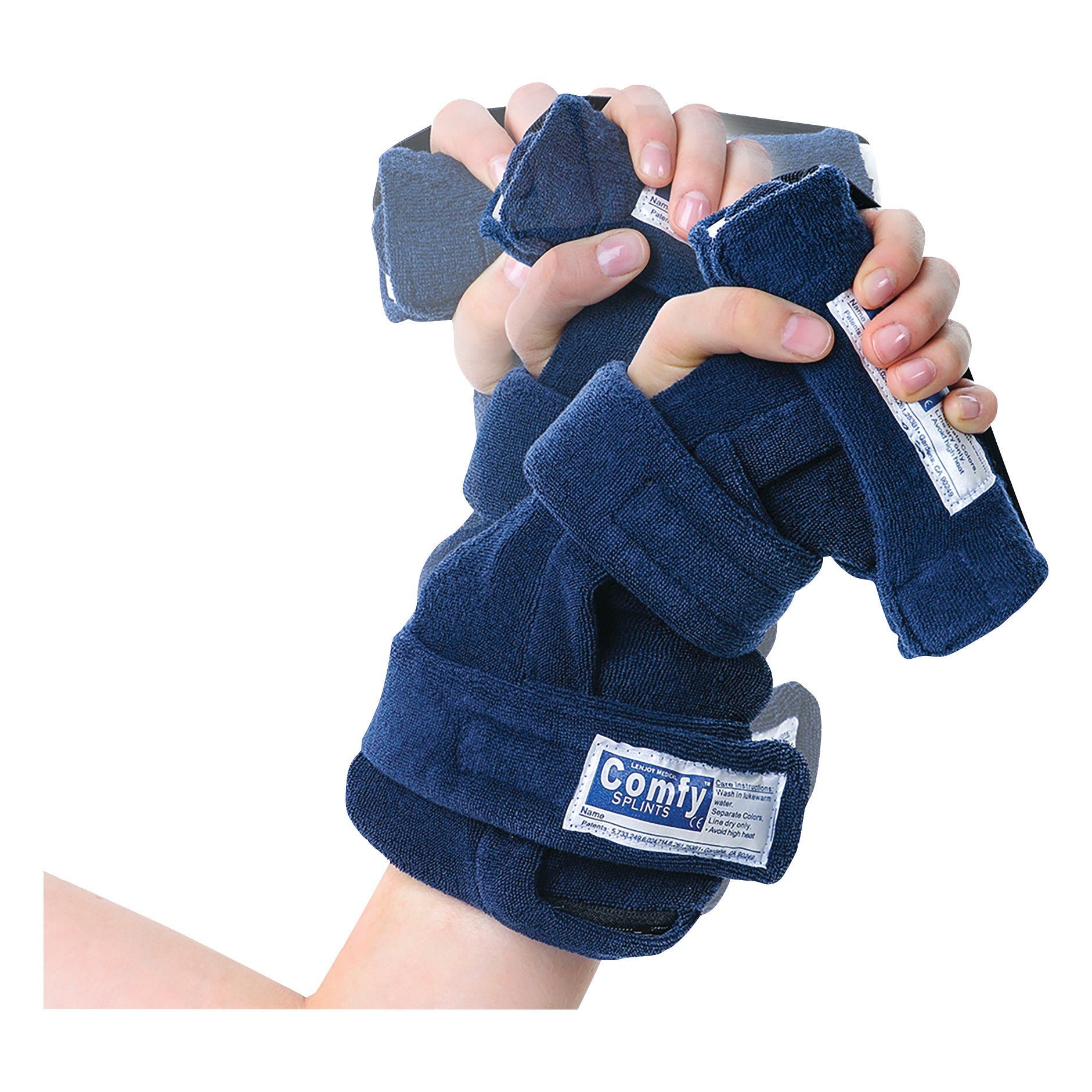 A person wears the Comfy Splints Adult Deviation Finger Extender Hand Orthosis, supporting and aligning fingers and wrist, in a blue fabric.