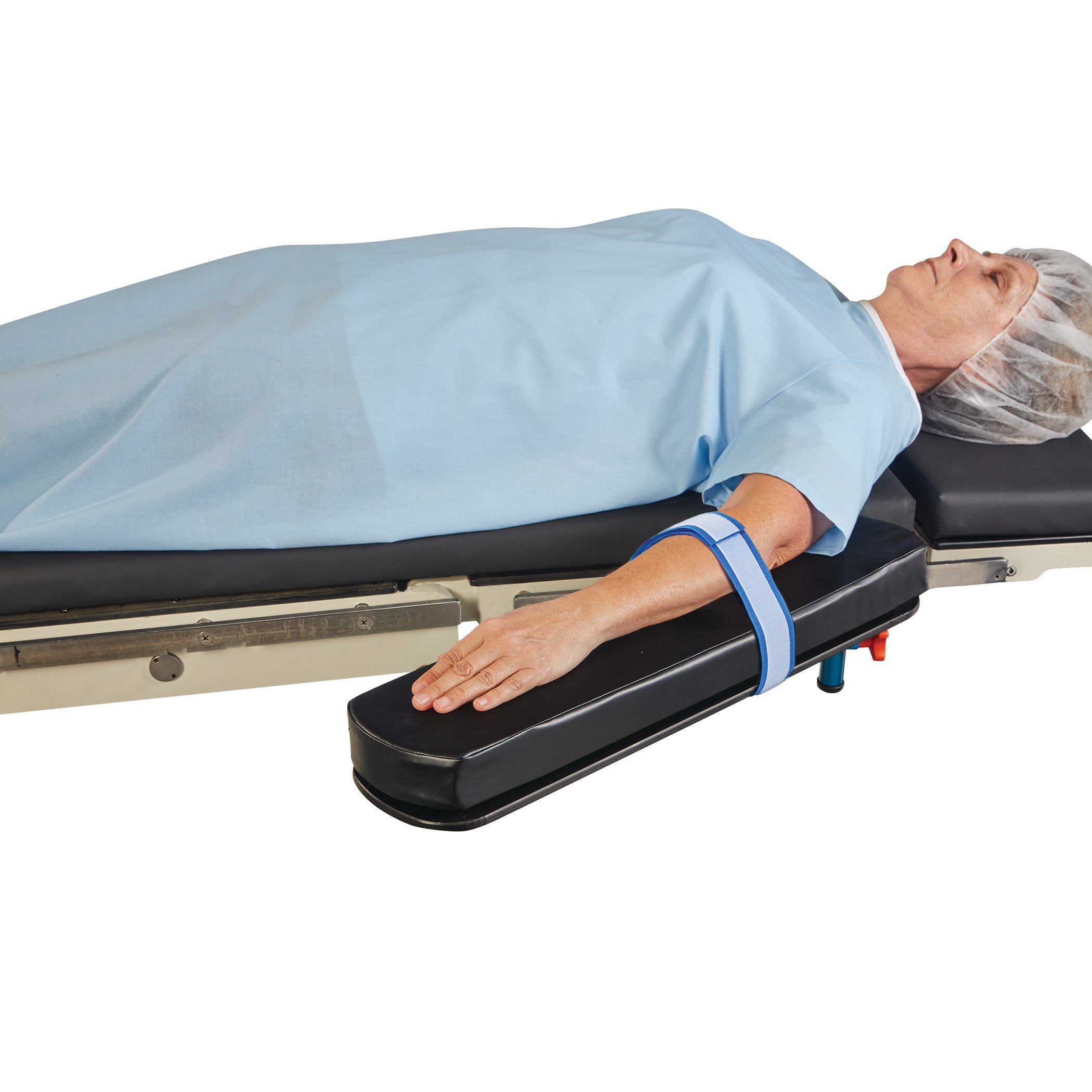 A patient lies on an operating table, with their arm secured by an AliMed AliStrap Precut Patient Safety Strap.