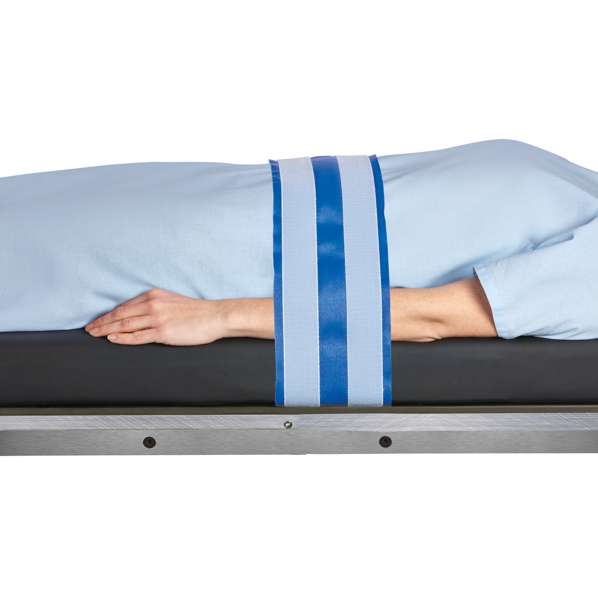 A person's arm is secured with the AliMed AliStrap Positioning Strap, featuring blue and white stripes, on a padded surface.