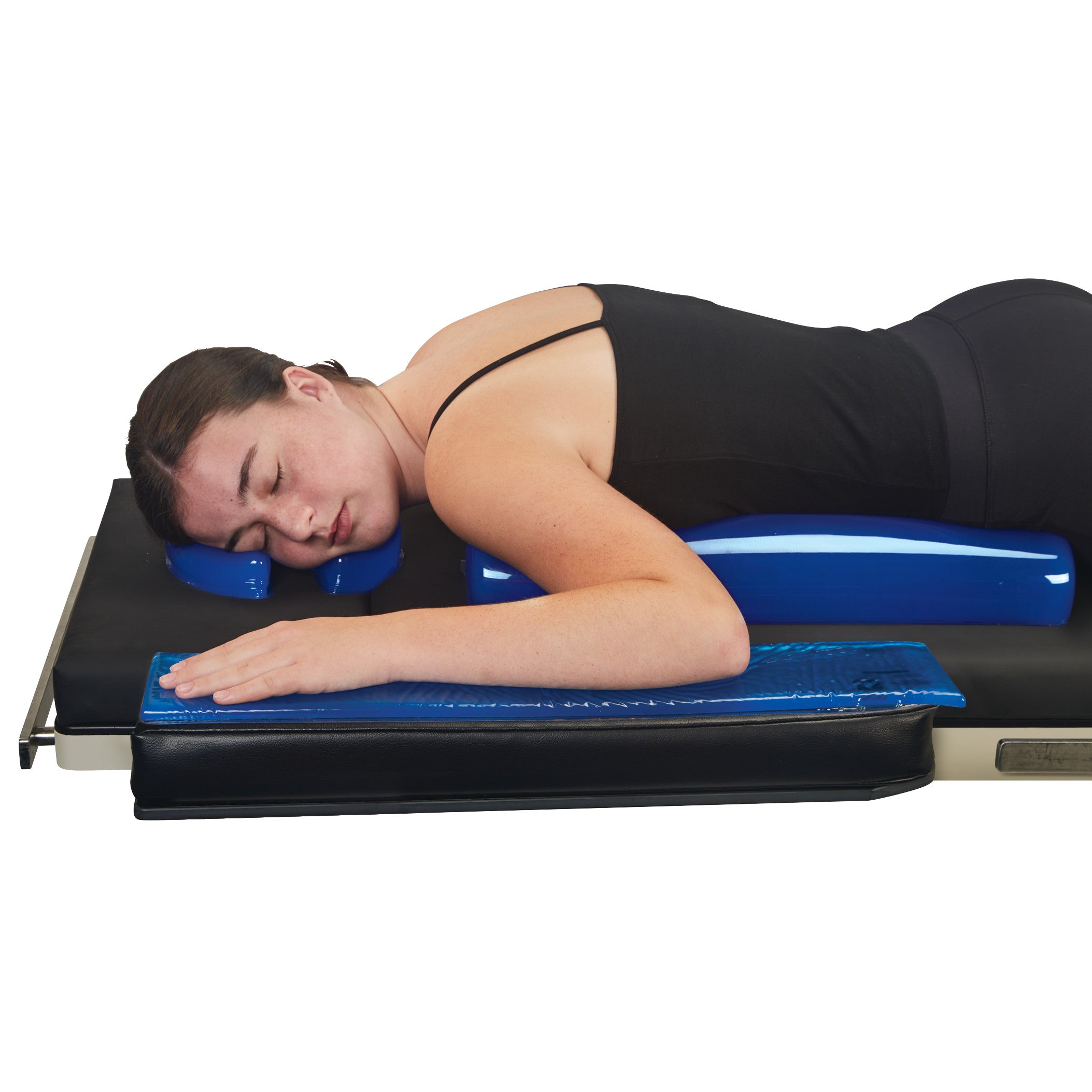 A person rests on their stomach using the AliMed AliBlue Gel Chest Roll, a blue gel support under their chest and head.